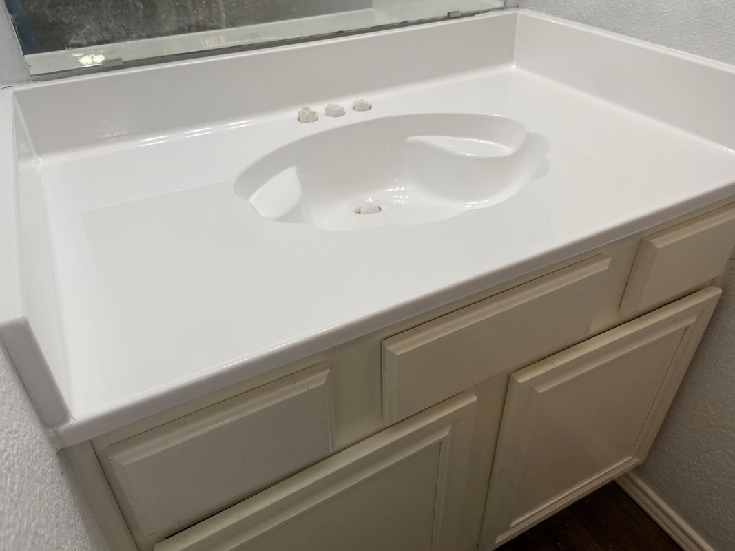 Picture of a refinished bathroom vanity. 