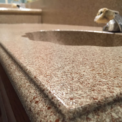 Image of Sedona Small  on refinishing kitchen countertop. you can see the refinished Tile with brown and white color. 