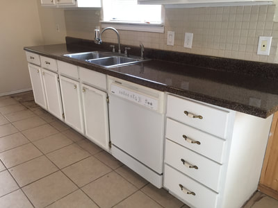 Picture of newly refinished kitchen countertops. It looks very attractive to see the remodeled countertop. 
