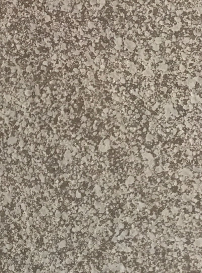 This image shows the Small Lucid Pebble pattern for a countertop resurfacing. You can see a tan background with small red and brown pebble spots.