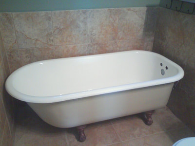 Picture of a bathtub that is refinished. The tub is looking white and beautiful.