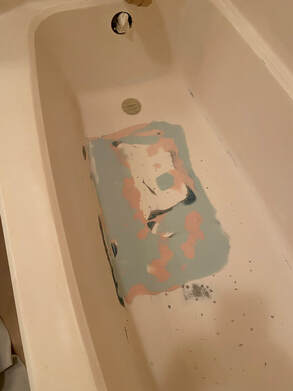 Picture a bathtub that is in the process of a refinishing project. THe last layer of finish is now being applied. 