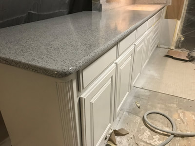 Image of a Grey Marble kitchen countertop resurfacing. You can see an ongoing countertop resurfacing project. 