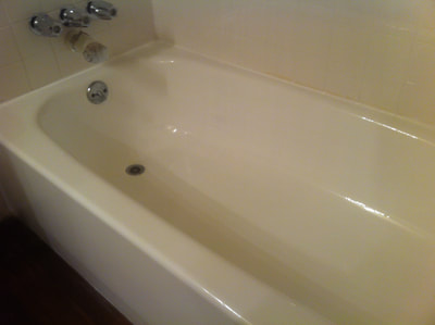 Picture of a bathtub that looks nice, clean and inviting. 