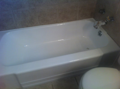 Picture of a bathtub that looks nice and modern. The tub got reglazed and has a nice and shiny white finish to it. 