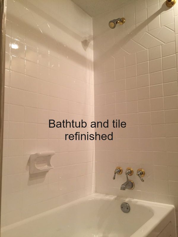 picture of bathtub and tile refinishing job. You can see shiny white tile and bathtub.