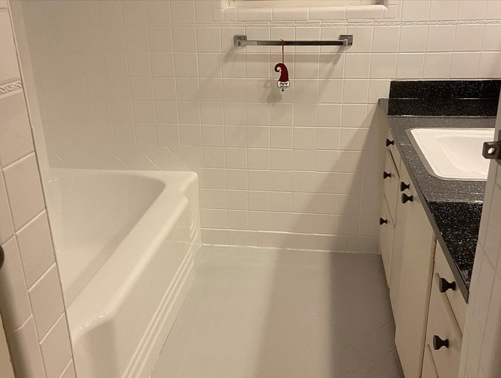 Picture of a bathtub that recently got resurfaced. In the picture you can see a modern looking bathroom, and because of the refinishing done to it, it will last much longer! 